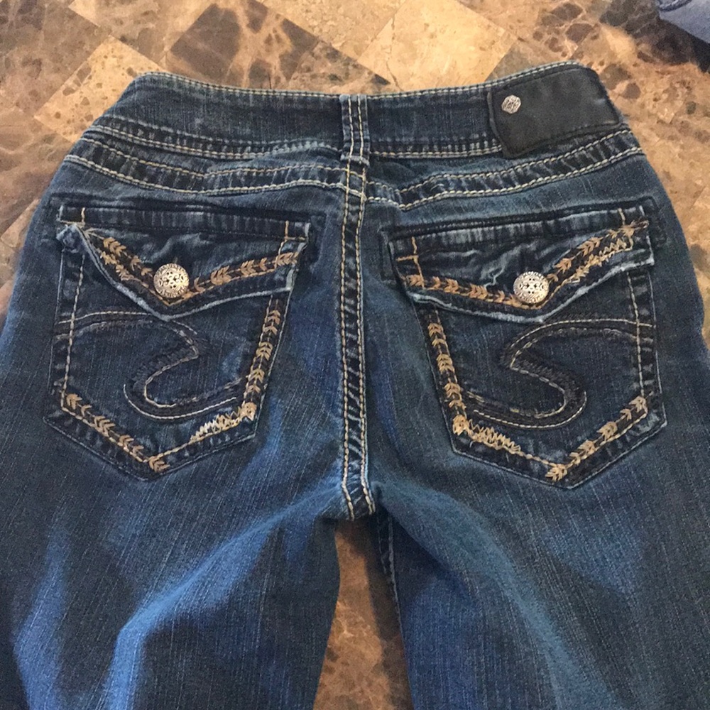 Silver jeans.